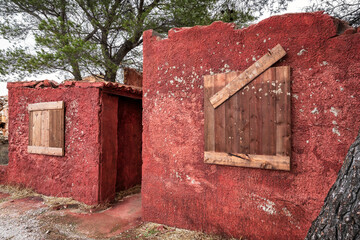 Wall Mural - Abandoned Miners Residence with Red Walls in Lavreotiki