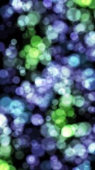 Wall Mural - vertical purple to green bokeh sphere lights 4k loop features purple, blue, and green colored defocu