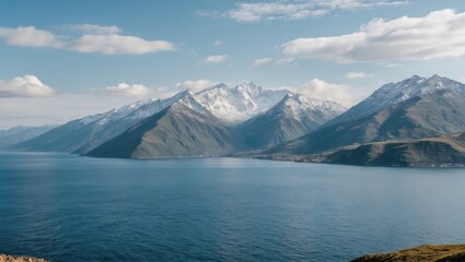 Poster - Serene Mountain Landscape Overlooking Calm Sea with Clear Blue Sky and Space for Text or Graphics