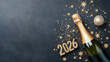 © Ruzana - Festive new year celebration with champagne bottle and glittering decorations