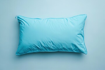 Sticker - An aqua blue pillow resting on a matching blue background