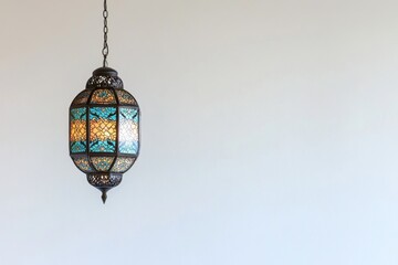 Poster - An ornate turquoise and gold lantern is hanging from a chain