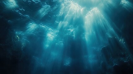 Wall Mural - Underwater blue ocean background with soft light rays streaming through