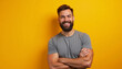 © dapra01 - Portrait of a Cheerful Bearded Man Vibrant and Confident standing on warm yellow background