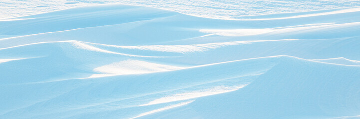 Wall Mural - snow texture. wind sculpted patterns on snow surface. wind in the tundra and in the mountains on the