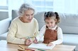 © NISHAN'S STUDIO - Grandmother Teaching Child to Draw – Loving Family Bond & Creative Learning