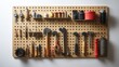 © Aisha - A sturdy wall-mounted pegboard organizer with hooks and tools, isolated on a white background