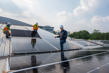 Wall Mural - Engineer service check installation solar cell on the roof of factory. Silhouette technician inspection and repair solar cell on the roof of factory. Technology solar energy renewable.