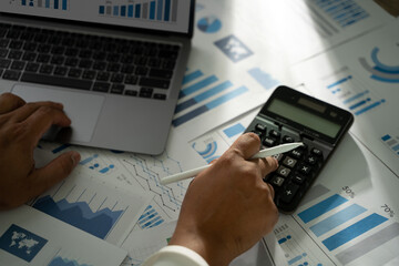 Poster - a person is using a calculator financial accounting business read report analysis graph data on pape