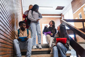 Canvas Print - High school students chatting on stairs during break time