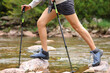 © Antonioguillem - Trekker woman legs crossing a mountain river