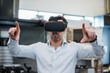 © Westend61 - Businessman using VR glasses in a factory