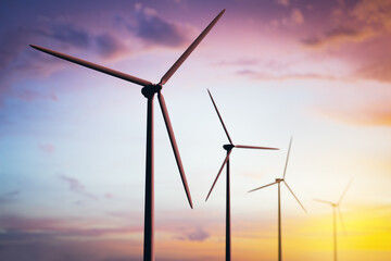 Poster - Wind turbines generating renewable energy at sunset.
