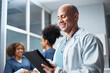 © Meeko Media - Smiling Healthcare Professional Using a Digital Tablet in a Medical Office