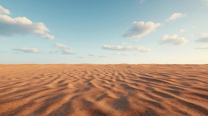 Poster - Weathering process idea. A serene landscape of gentle sand dunes under a clear blue sky with fluffy clouds.