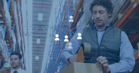 Poster - Image of media icons over caucasian male workers working in warehouse