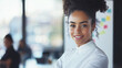 © Nazlykhan - Confident african female young adult smiling in business setting