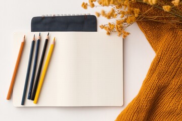 Poster - Warm Rustic Stationery Essentials Top-Down View of Bullet Journal with Colored Pencils and Cozy Textures - Inspiring Creative Organization for Modern Lifestyle and Planner Communities