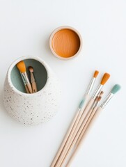 Aufkleber - Contemporary Minimalist Art Supplies Display Ceramic Holder with Brushes and Pigment on White Surface - Creative DIY Content and Home Aesthetics for Craft Enthusiasts