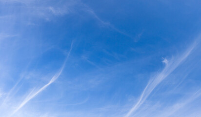 Wall Mural - Serene blue sky with delicate cirrus clouds forming light, wispy patterns