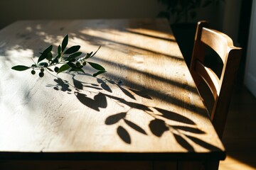 Aufkleber - The image features a bare wooden table top and a white wall with a blurred effect in a garden setting, complete with green leaves, ideal for displaying or combining with your products