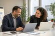 © AbdulHai - Business Professionals Collaborating in Modern Office Environment