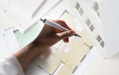 Poster - Architect draws engineering drawings of building. Creating room-by-room house plan. Hand of design engineer. Creation of construction drawings. Hand of architect from construction company