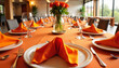 © Inna - Elegant orange napkin display on table setting, joyful ambiance