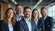 © miss irine - Successful diverse business team portrait in bright office. Smiling pro men, women in formal suits look at camera. Confident entrepreneurs, executives show teamwork, collaboration and leadership.