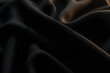 © Pixels Views - A dark, smooth fabric with subtle lighting, highlighting its fluidity and depth, and its intricate weave and graceful curves.