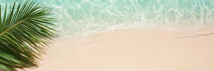 Poster - Crystal clear turquoise water washes over the pristine white sand beach where a vibrant green palm leaf lies, creating a serene and idyllic tropical paradise scene