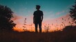 © Dwina - Man silhouetted against sunset, starry sky, field. Contemplation, peace, nature.