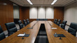 © Ben - This is a formal conference room with a long wooden table, black leather chairs, built in microphones, and wood paneled walls.