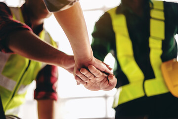 Aufkleber - A group of construction workers are shaking hands