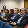 © GS-Studio - Focused Audience: An attentive audience, their faces etched with contemplation, observes a speaker, creating a scene of focused learning and intellectual engagement.