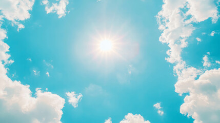 Poster - Bright clear blue sky with radiant sunlight and fluffy clouds ideal for summer designs