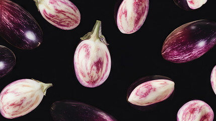 Poster - Drifting halved eggplants on dark background for creative design
