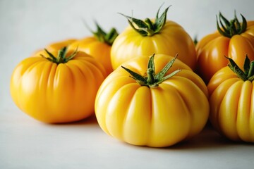 Poster - Fresh and ripe yellow tomatoes arranged on a table, perfect for still life photography or food styling