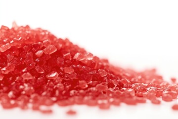 Poster - A pile of vibrant red sugar crystals on a white surface, perfect for use in food and cooking illustrations