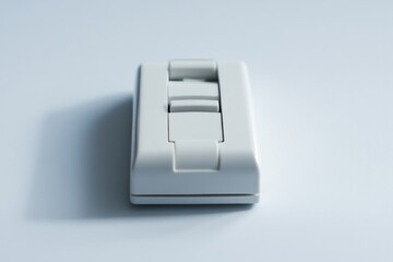 Poster - A close-up shot of a white switch on a wall, suitable for use in interior design or renovation projects