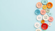 © A2Z AI  - Colorful Sewing Buttons on Blue Background: A vibrant collection of differently sized buttons, perfect for crafts and design projects.