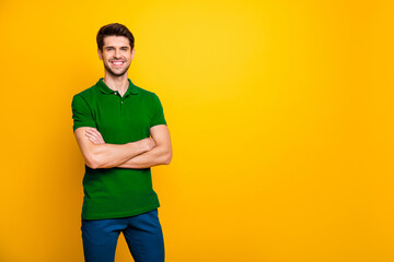 Poster - Portrait of his he nice attractive cheerful cheery content brown-haired guy folded arms copy space isolated over bright vivid shine vibrant yellow color background