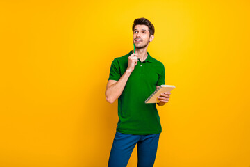 Poster - Portrait of his he nice attractive minded focused concentrated guy creating making notes exercise book isolated over bright vivid shine vibrant yellow color background