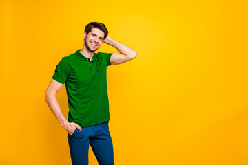 Poster - Photo of cheerful white handsome posing guy standing next to empty space with hand in pocket demonstrating the result of hairstylist work isolated over vivid color background
