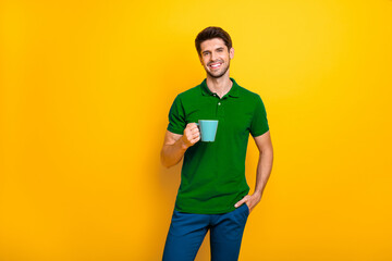 Poster - Portrait of his he nice attractive cheerful cheery content guy drinking espresso spending good morning day isolated over bright vivid shine vibrant yellow color background