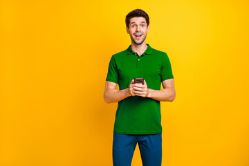 Aufkleber - Portrait of his he nice attractive addicted delighted cheerful cheery guy wearing violet shirt using digital device modern technology isolated on bright vivid shine vibrant yellow color background