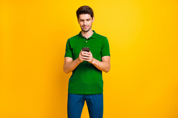 Aufkleber - Portrait of his he nice attractive content focused concentrated guy wearing violet shirt browsing web date service isolated on bright vivid shine vibrant yellow color background