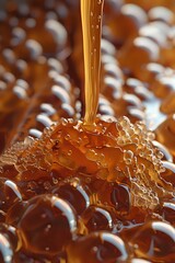 Poster - Golden honey dripping onto honeycomb surface creating bubbles and texture, macro photography with amber tones and natural light showing liquid viscosity.