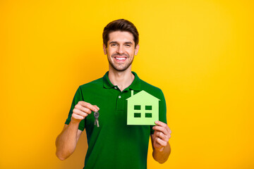 Poster - Photo of cheerful positive white inverstor advertising his line of houses to be sold out holding paper building and key to a flat isolated over vivid color background
