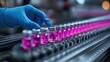 © Subatheesan - Hand in blue sanitary gloves inspecting medical vials on a conveyor belt